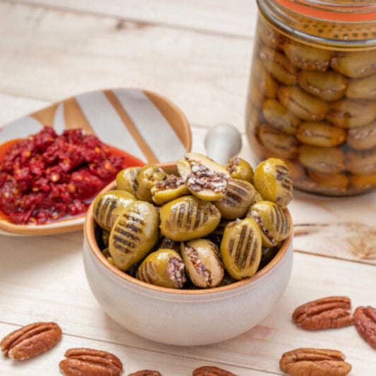 Grilled olives stuffed with walnuts and hot pepper