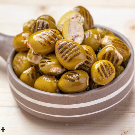 Grilled olives stuffed with walnuts, labaneh and hot pepper