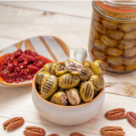Grilled olives stuffed with walnuts and hot pepper